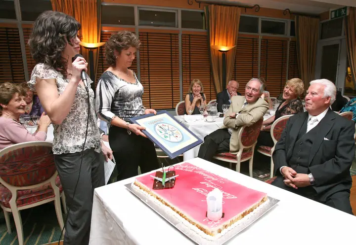 Jackie and Natacha Presenting a Tree of Life to Johnny